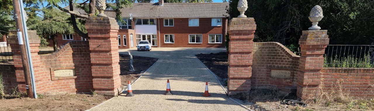 This is a photo of a newly installed chip and tar driveway, installed by March Driveways